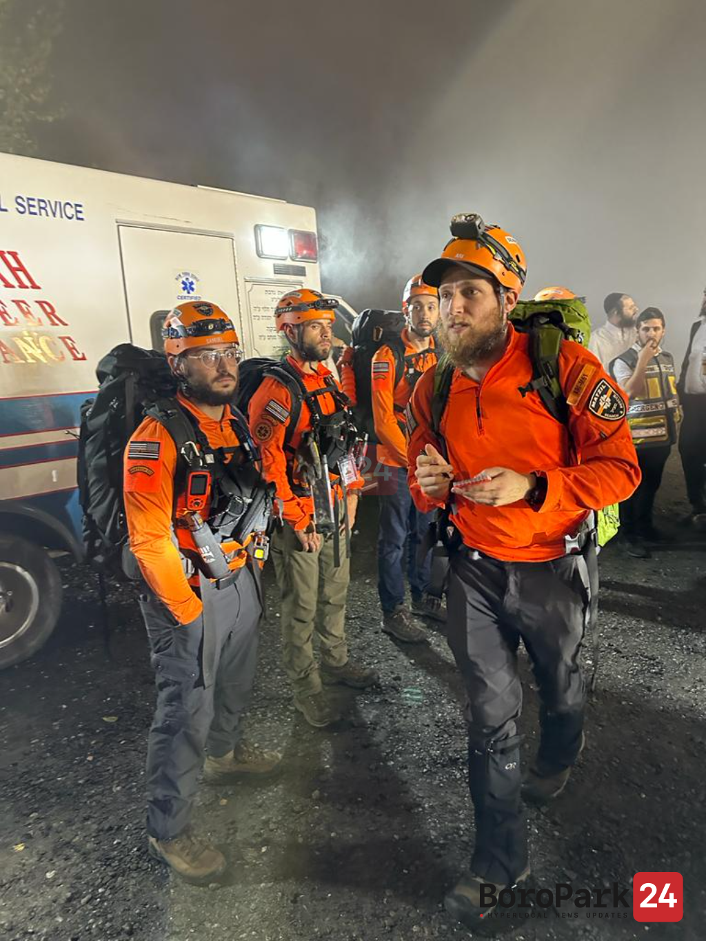 Search-and-rescue teams after locating the missing hikers