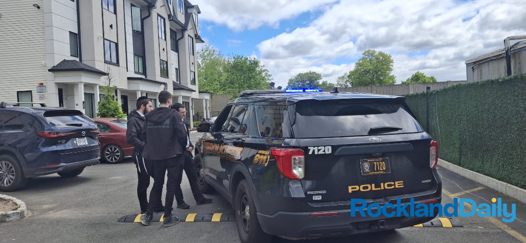 Spring Valley Police and Chavivim volunteers on Twin Avenue documenting the scene
